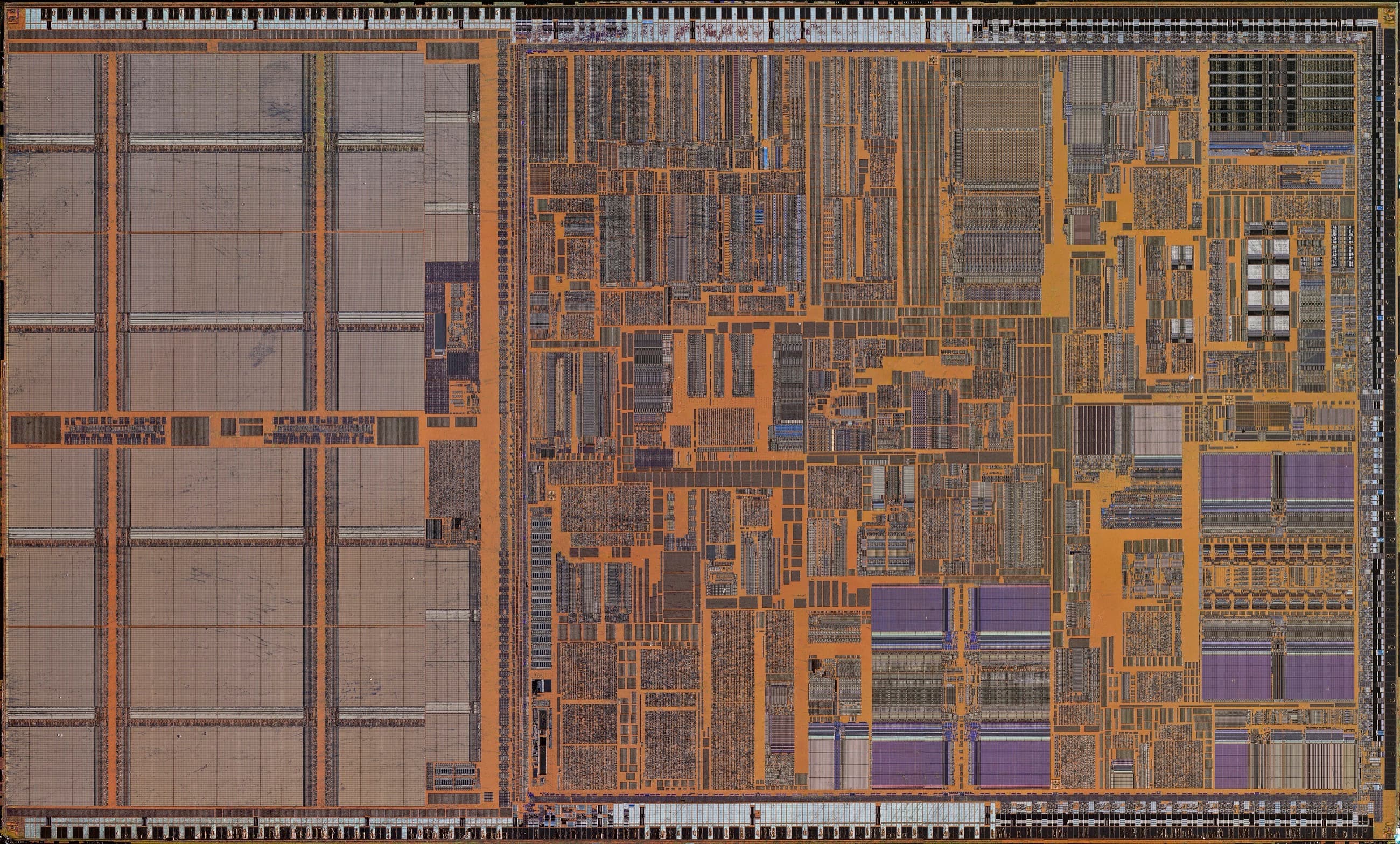 Microscope photograph of a processor die showing blocks of copper-colored circuitry.